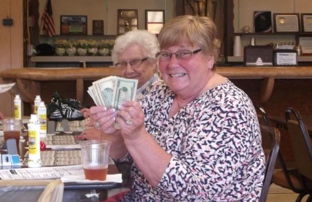 Judy Blackburn celebrates her winnings at the 2014 BINGO Bonanza trip with Sissie Hansen.