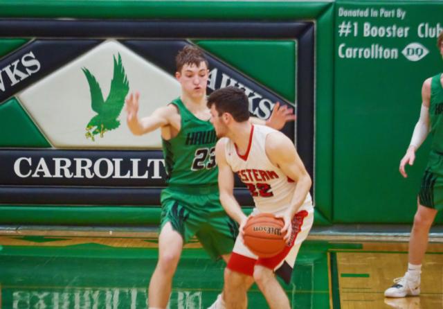 Carrollton's Nathan Walker (23) defends Barry (Western's) Preston Wellman (22) in the second half of the Carrollton Regional Semifinals on Wednesday night.