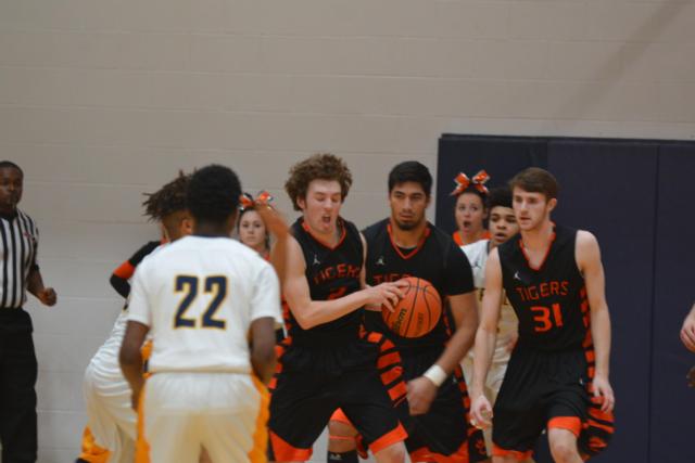 Edwardsville's Jack Marinko takes the ball in back court against O'Fallon. (Photo by Dan Brannan)