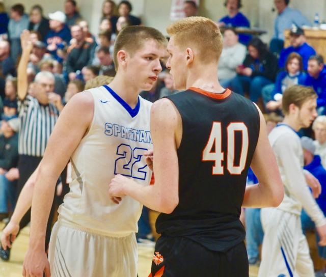 Josh Hopper of North Greene and Lincolnwood's Matt Mizera battled all night long in the post. North Greene defeated Lincolnwood 63-41 to advance to the regional finals in the Raymond (Lincolnwood) Regional.