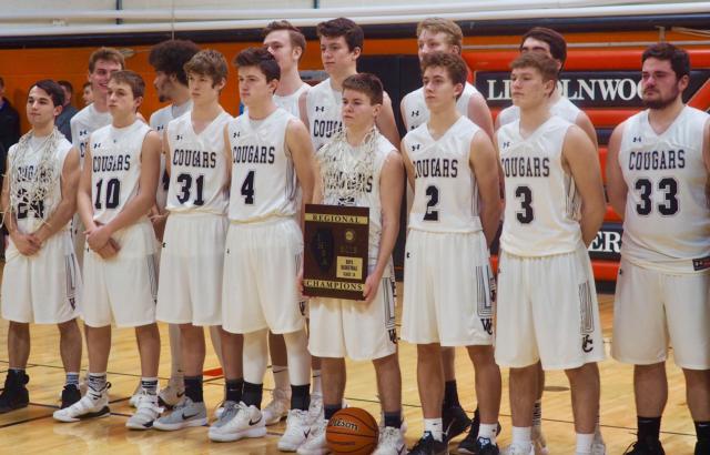 The West Central Cougars team poses for pictures after holding off North Greene.