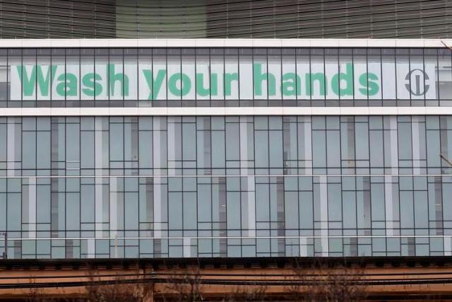 A sign is displayed at Rush University Medical Center in Chicago, Saturday, March 28, 2020.