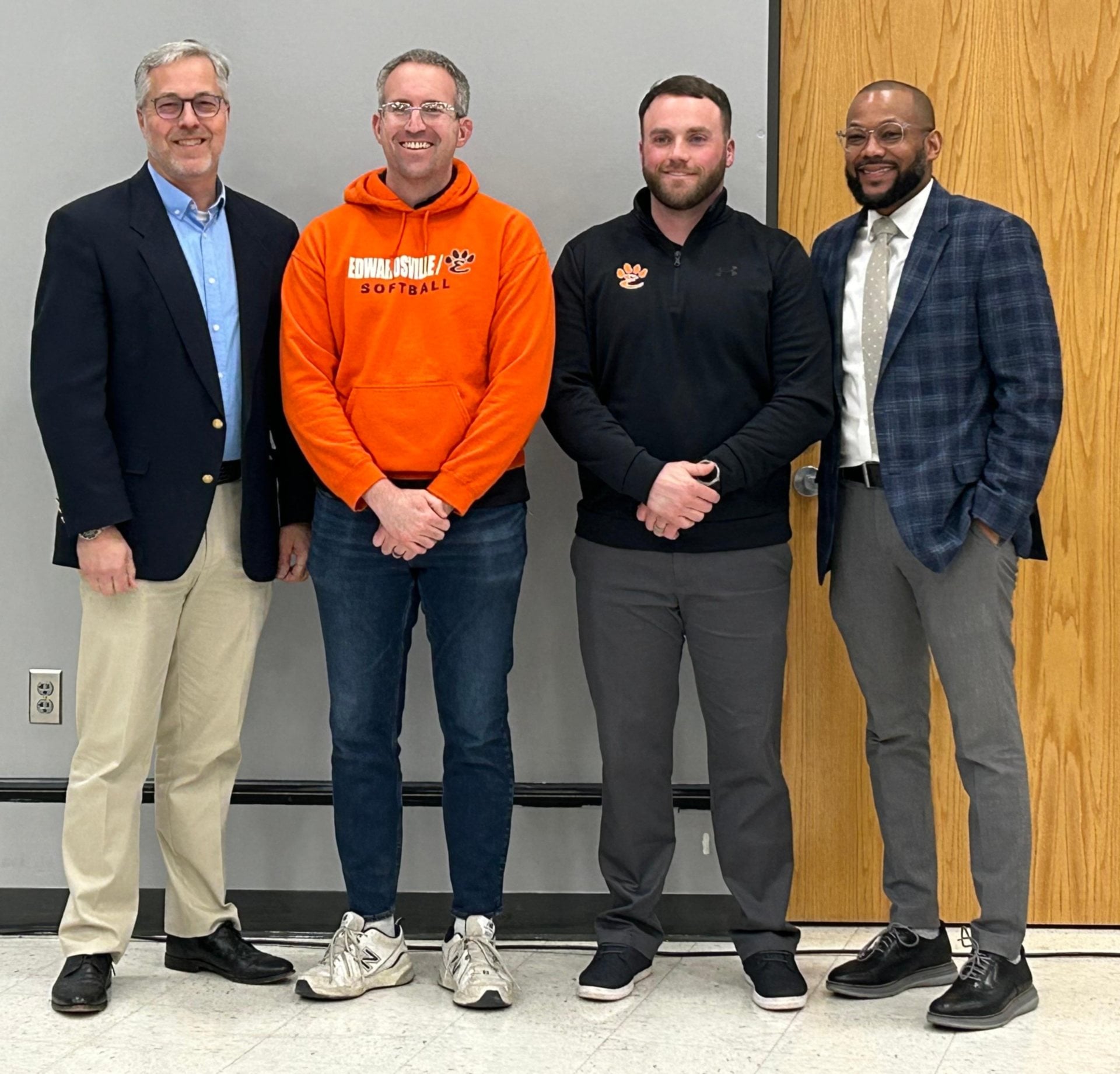 Board of Education President Bob Paty, Coach Kirk Schlueter, Coach Mike Sabatino, and Acting Superintendent Dr. Allen Duncan.