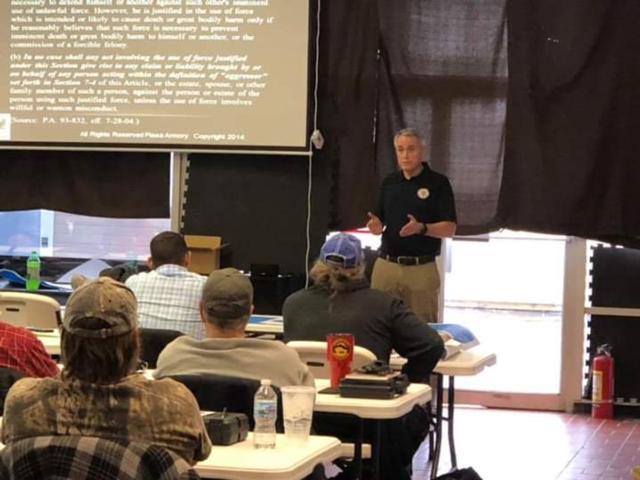 Photo of Tom Gibbons instructing a class taken from the Piasa Armory Facebook Page. Used with permission.