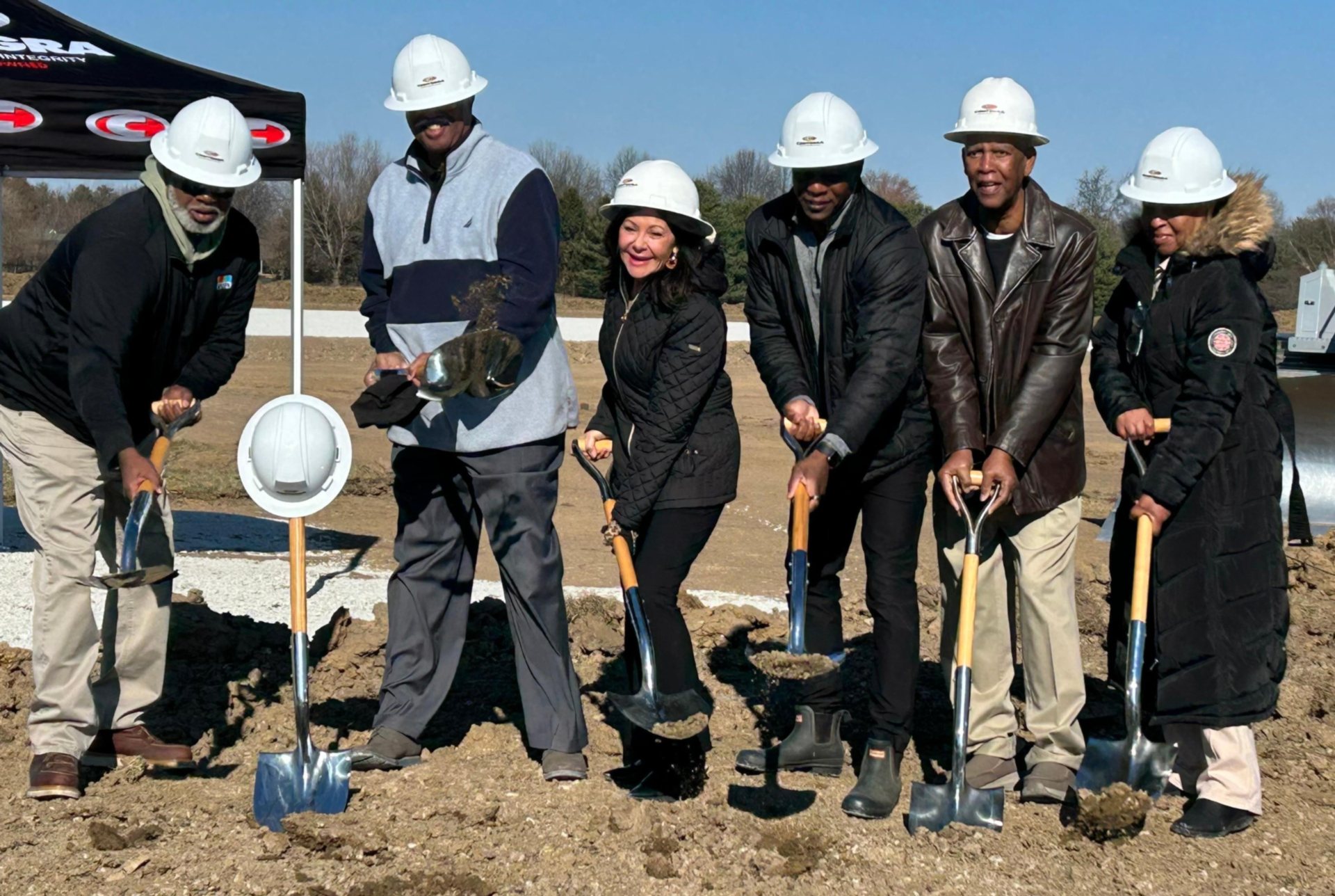 Mark Thomas and his family celebrate the groundbreaking ceremony.