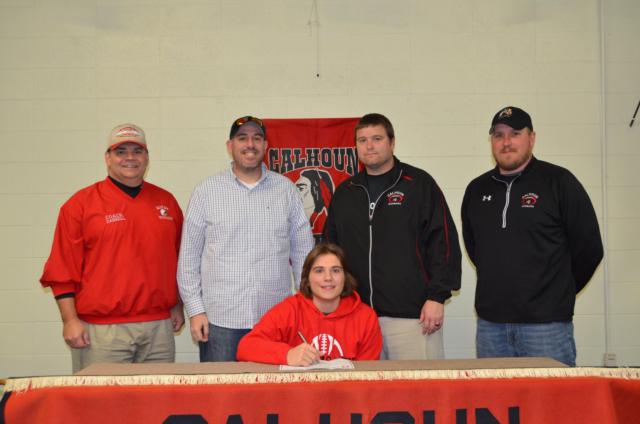 Brandon Kizer with a variety of coaches at his signing. They are former Renegades/MCHS coach Darrell Angleton; former MCHS Head coach/defensive coordinator Tim Nelson; and Calhoun head coach Aaron Elmore.