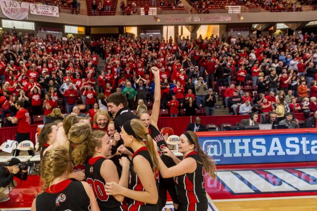 Calhouns' Aaron Baalman is hoisted in the area by his Calhoun jubilant Warriors' players after the state championship win on Saturday afternoon. (Photo courtesy of Michael R. Weaver)