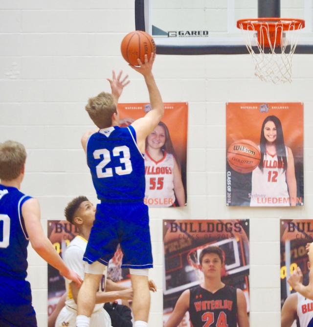 Jordan Holmes (23) goes up for layup against Civic Memorial.