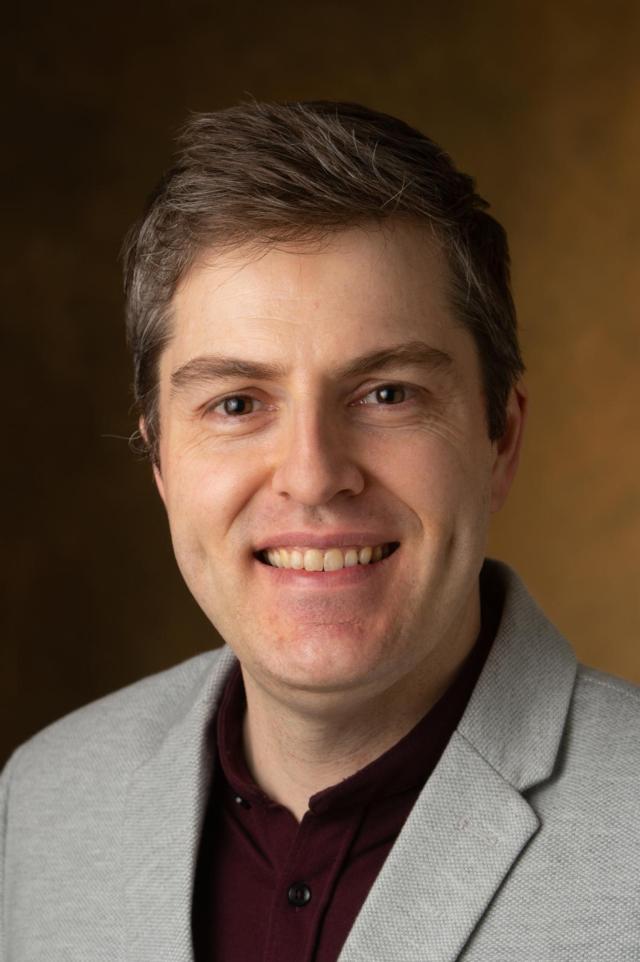 Andrew Greenwood, PhD, assistant professor of musicology and graduate program director in the College of Arts and Sciences&rsquo; Department of Music.