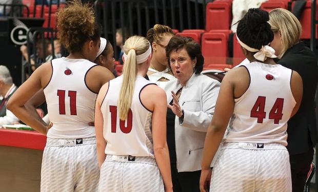 Head Coach Paula Buscher talks to her team