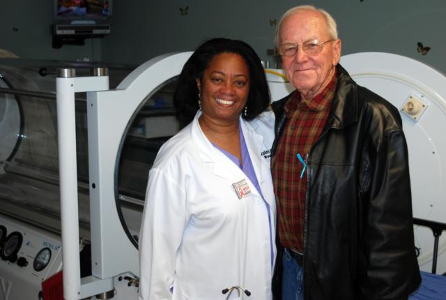 Dr. Valinda Allen, medical director of the Wound Care Center at Alton Memorial Hospital, with Larry Mayfield of Carlyle, Ill., who credits Dr. Allen and the Wound Care Center with saving his leg.