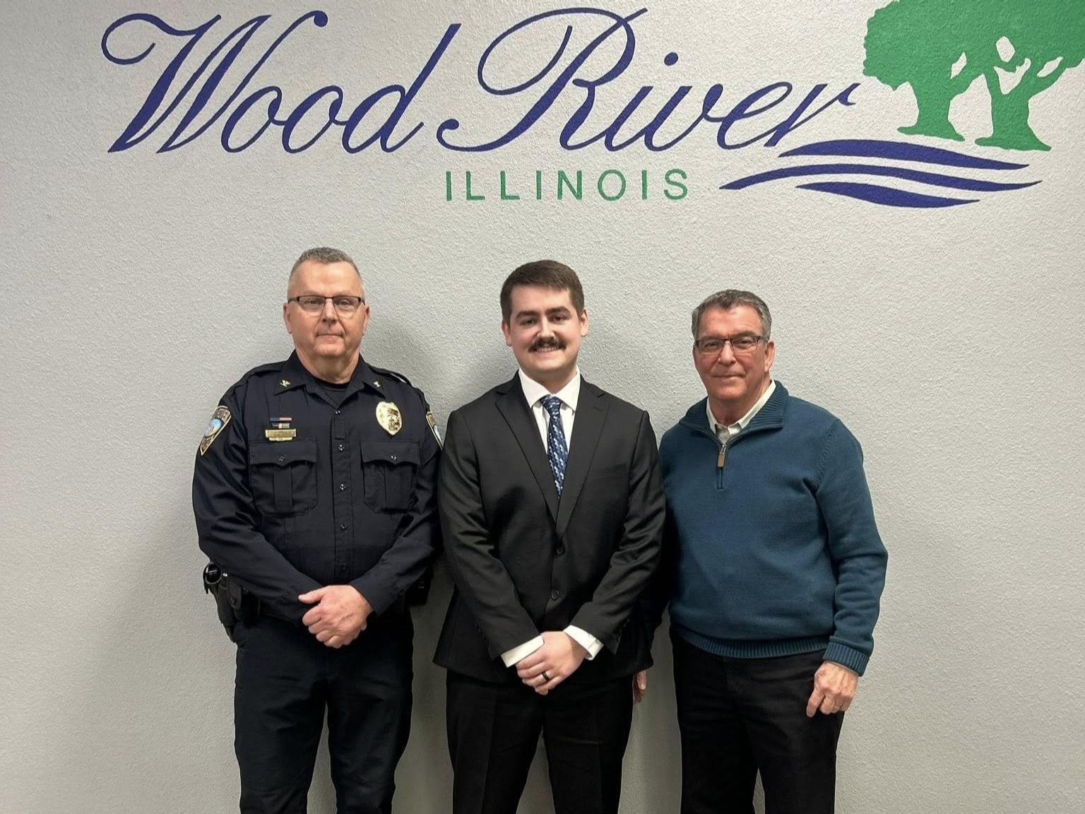 From left to right: Police Chief Brad Wells, Probationary Police Officer Joel Woodruff, and Mayor Tom Stalcup.