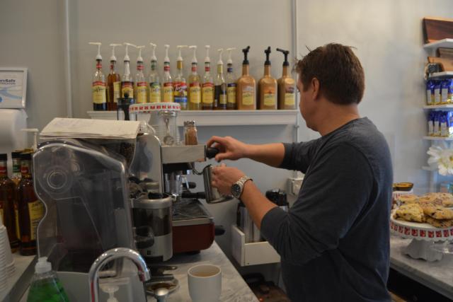 Ryan Schuler prepares a drink for a customer.
