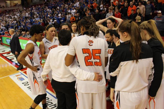 Criste'on Waters embraces Lori Blade as the team connects for one final huddle. 