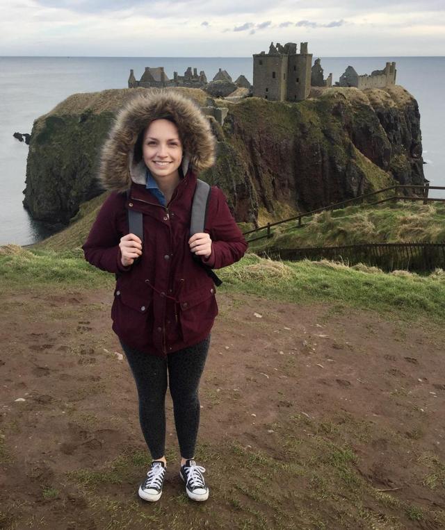 Peoria native and SIUE alumna Alexa Knuth stands outside a Scottish castle as she explores the countryside.