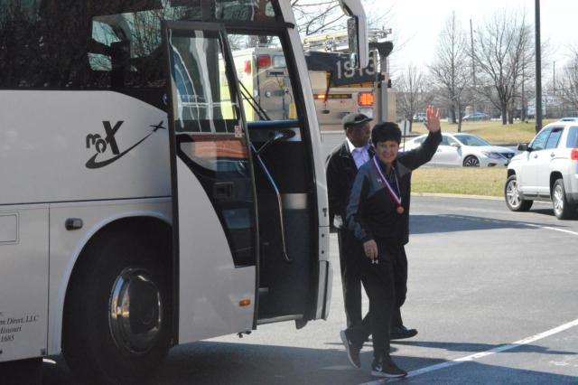 Tigers' coach Lori Blade waves to a crowd as Edwardsville returns home Sunday from the girls state basketball finals. (Photo by Brent Feeney)