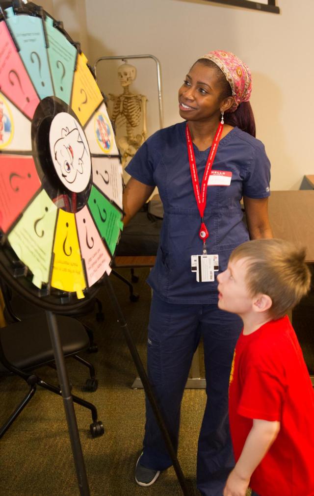 JaTerra Castine-Ross, a third-year SIU School of Dental Medicine student, leads an educational station during National Children’s Dental Health Month.