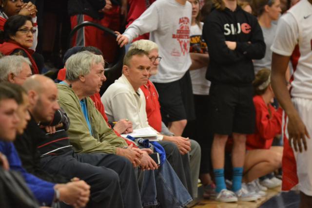 Richard Baird (far right) and some other fans are constant supporters of Alton&rsquo;s basketball program. The Alton High athletic department expects strong support of the team this Friday when it travels to the IHSA Class 4A Pekin Sectional championship game.