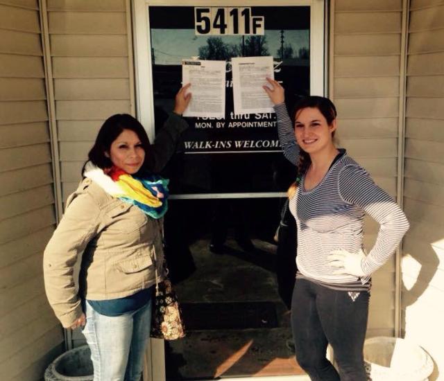 Erin Ahlfield and Lety Murphy stand in front of the door of their new business in Godfrey.