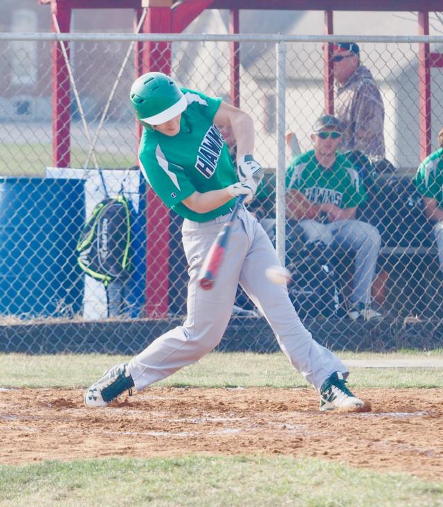 Walker swings at a pitch against Carlinville early in the 2018 season.