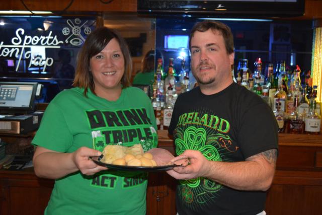 Brandie DeSherlia of Alton Sports Tap shows off some of their corned beef and cabbage.