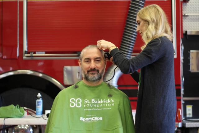 John Roberts goes bald for St. Baldrick's.