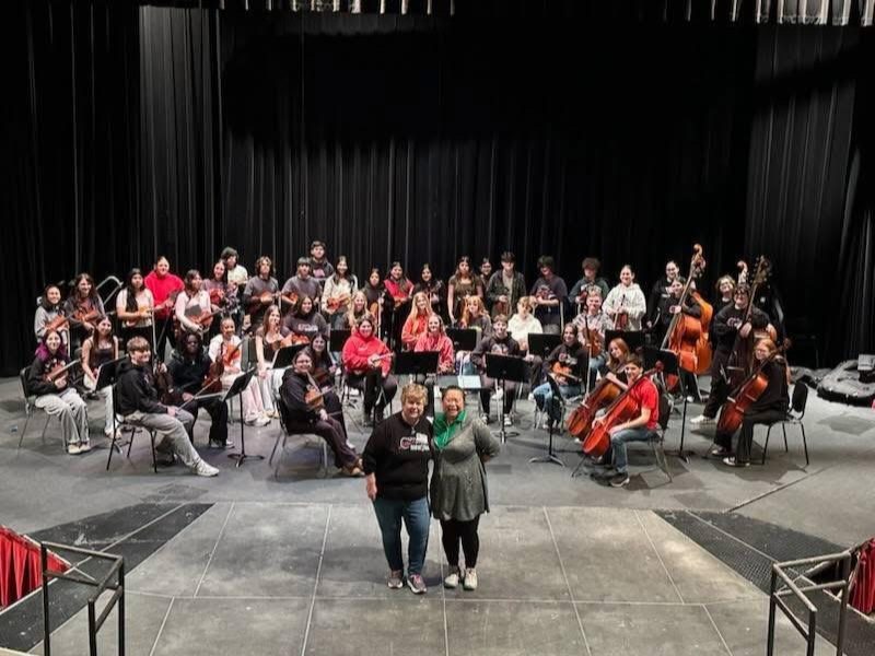 Students recently traveled to Chicago to perform. This photo shows Alton orchestra students, Laura Plummer, Yuhm Pham and students from Palatine High School.