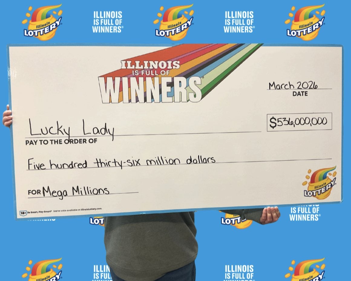 An Illinois iLottery player poses for a celebratory photo after winning the massive $536 million Mega Millions jackpot.