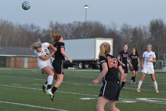 Lexi Norton goes for a ball in Friday's soccer game at Edwardsville against Springfield.