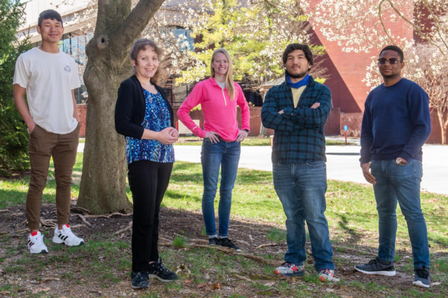 DSI students surround C-PAN Director Carrie Butts-Wilmsmeyer (second from left), including (L-R) Michael French, Courtney Flach, Elijah Florence and Ugochukwu Eleonu.