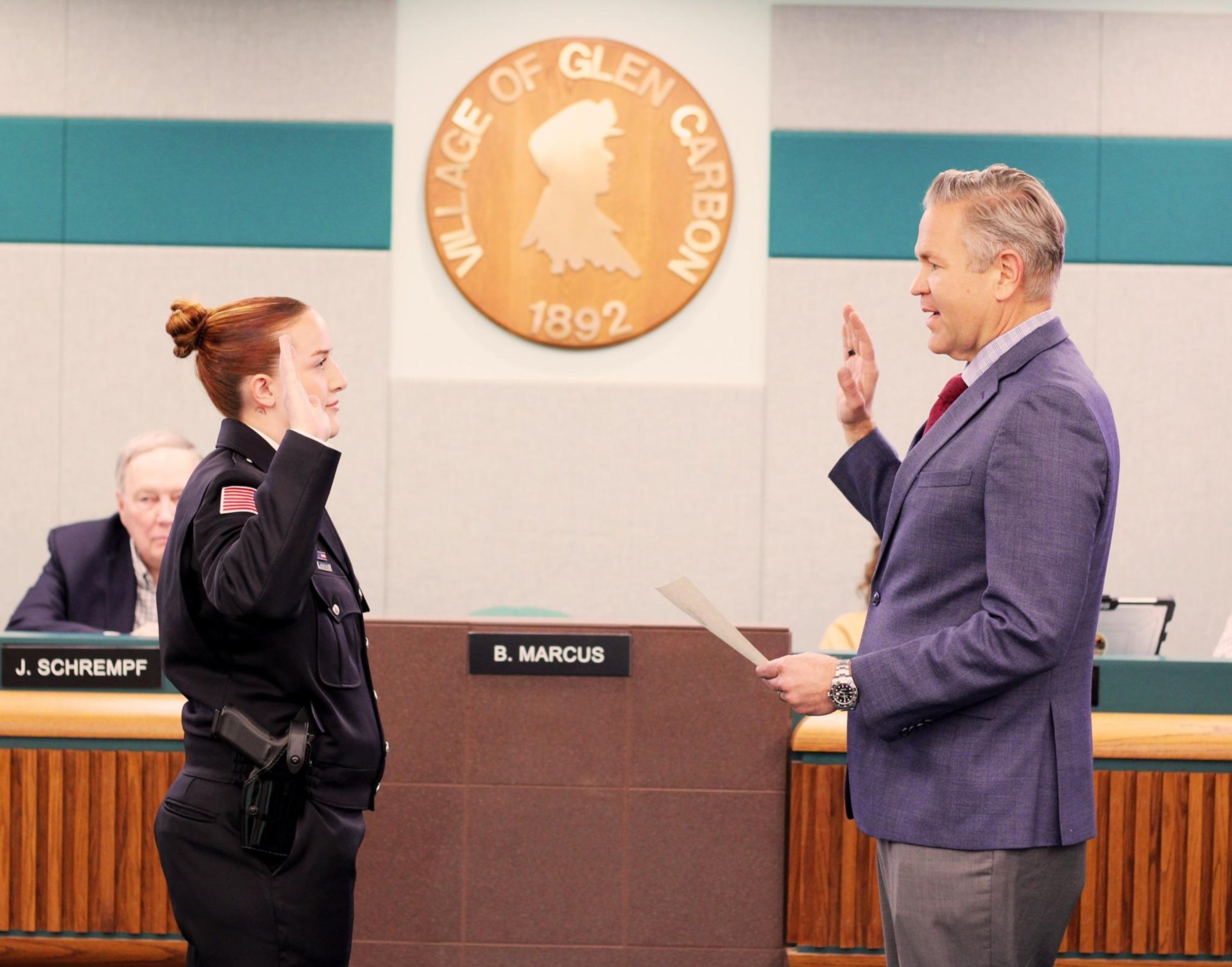 Officer Megan Dotzert is sworn in by Mayor Bob Marcus.