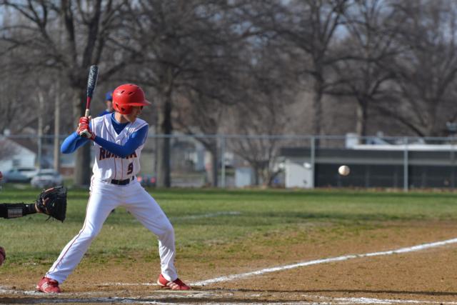 Roxana's Joe Ingram eyes a fastball during the Highland game on Friday. (Photo by Dan Brannan)