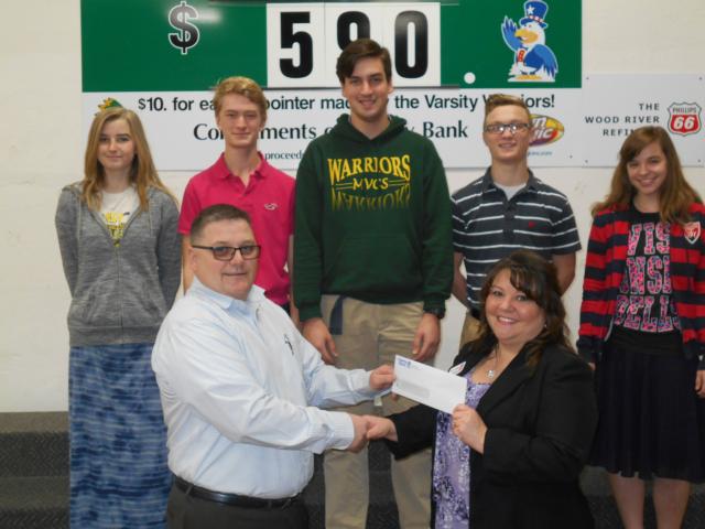 Mississippi Valley Christian School – MVCS Athletic Director James Schell, Liberty Bank’s Denise Woolsey and members of the Warriors Basketball Teams