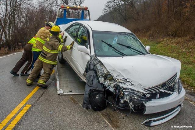 Firefighters work to move a car after a two-car head-on collision near the Brussels Ferry on Wednesday. (All photos courtesy of Michael Weaver)