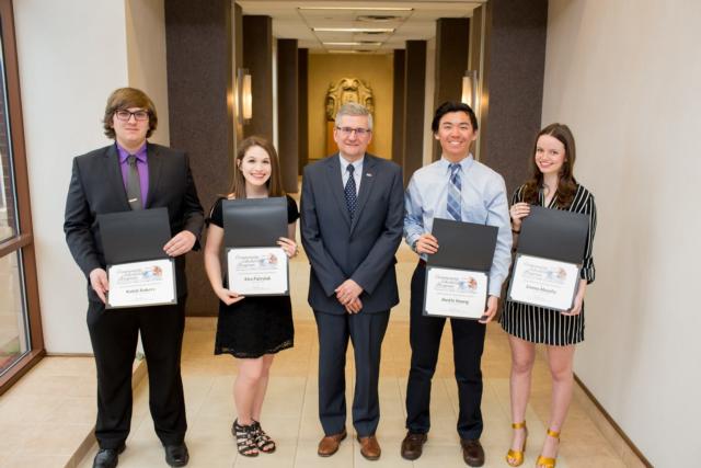 Pictured, from left, are Kaleb Rakers, Kira Patrylak, TheBANK President and CEO Kevin Powers, Austin Huang and Emma Murphy.