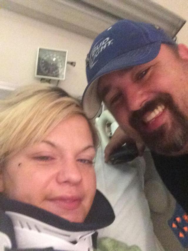 Anthony Greene visits Catelyn Scoggins in her hospital room in St. Louis Thursday evening.