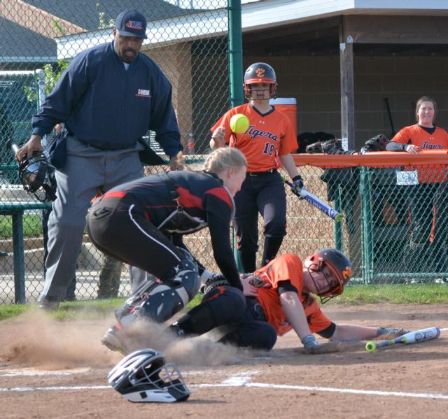 A play at the plate on Friday in the Edwardsville-Triad girls softball game at Edwardsville. (File photo by Dan Brannan)