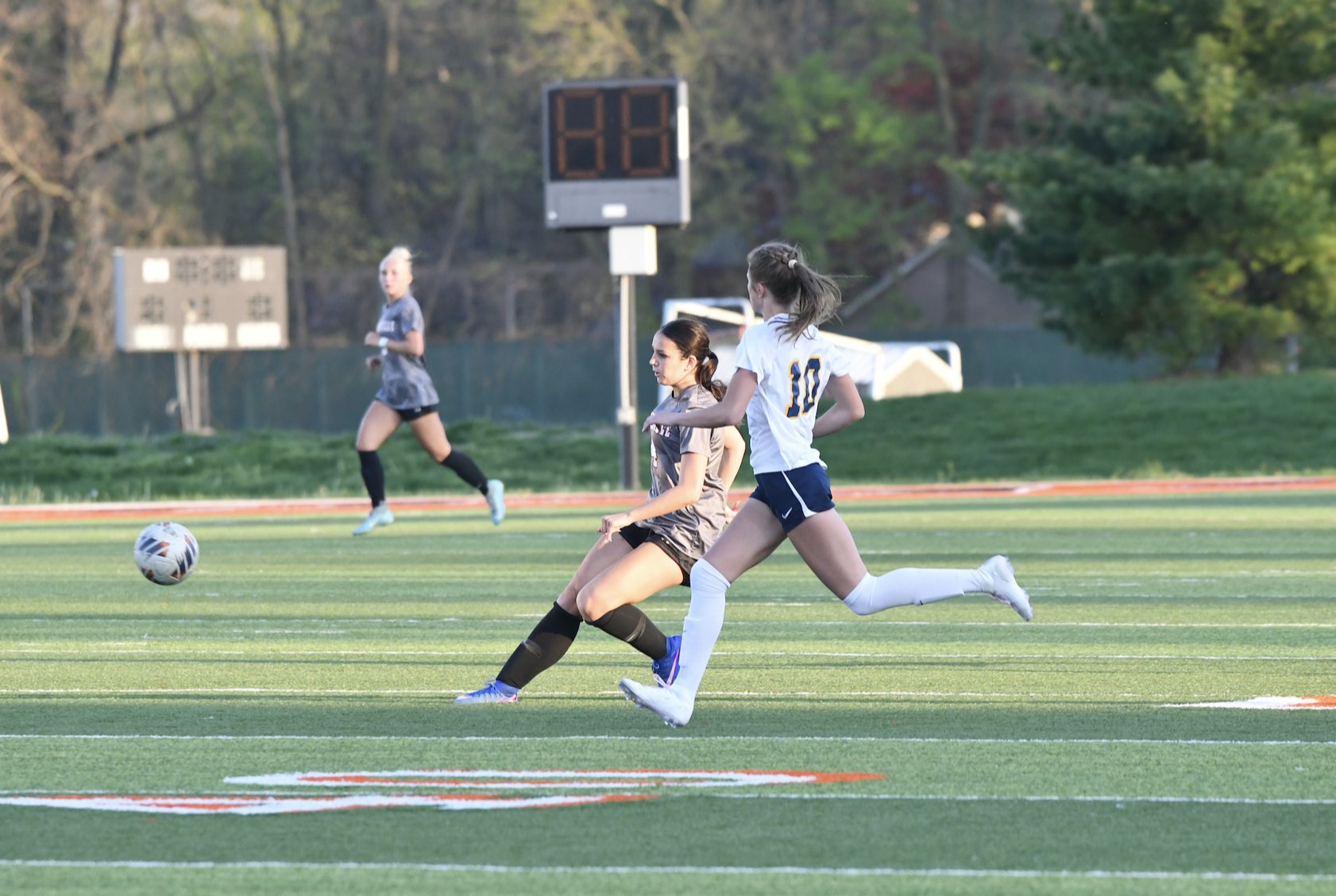 The Tigers' Thea Dimitroff goes in for the ball against O'Fallon.