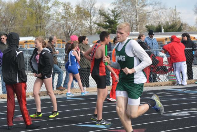 Chase McAdams was versatile on Friday in the Jersey Co-Ed Relays, participating in the shot put relay and also running for the Hawks. (Photo by Dan Brannan)