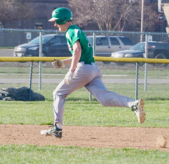 Nathan Walker sprints to third base.