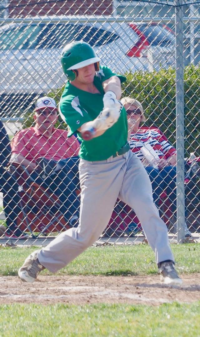 Alex Bowker rips a base hit part of a 12 hit day for the Carrollton Hawks in Gillespie on Thursday afternoon.
