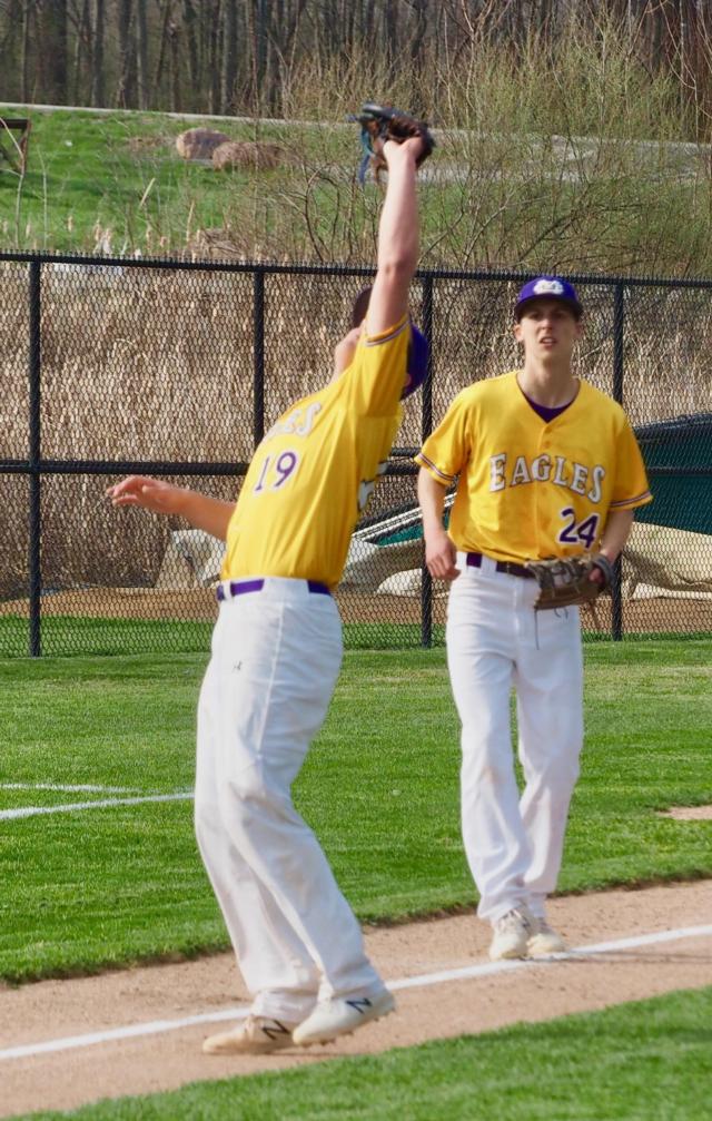 Spencer Powell catches an infield fly with Zach Vaughn backing him up.