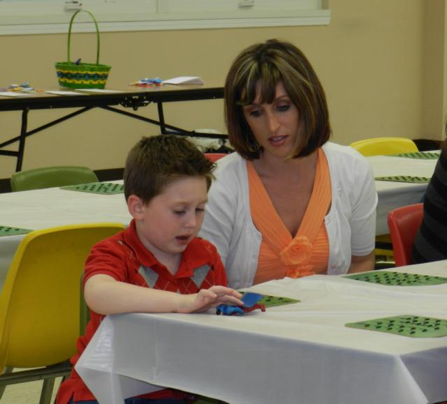 Winn Photo: Logan, then 5, and mom, Tabitha Winn, are trying to win some prizes during Fun BINGO at the 2014 Mom & Son Fiesta.