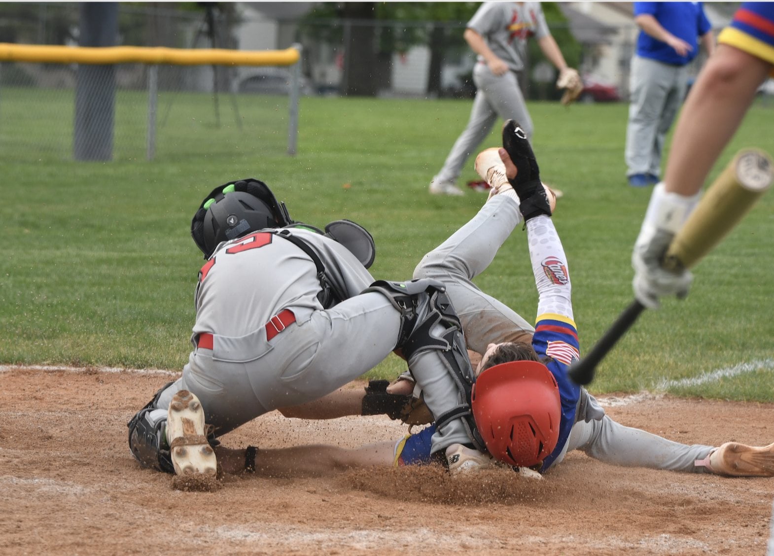 A play at the plate in the Alton-Roxana baseball game on Wednesday. (Photos by Dan Brannan).