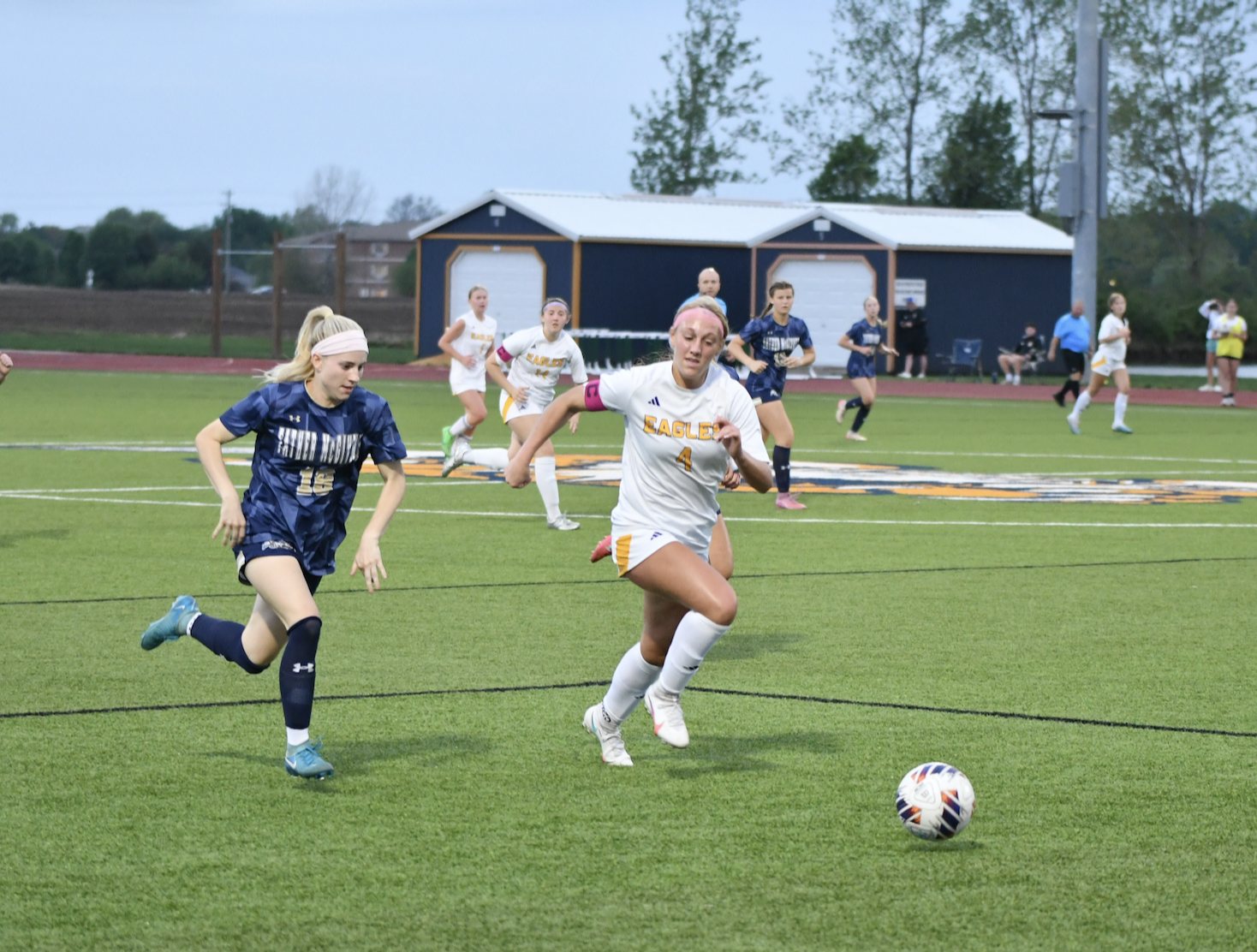 Emerson Isringhausen darts after the ball for the Griffins on Wednesday night with Civic Memorial's Delaney Griffin. (Photos by Dan Brannan).