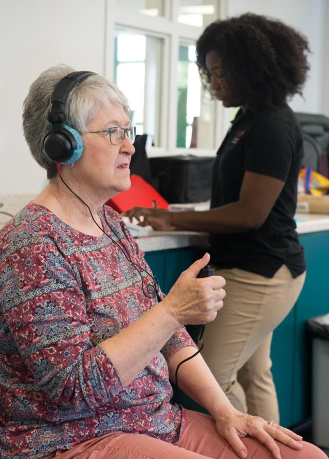 Karen File had her hearing screened by SIUE speech-language pathology graduate student Jenee’ Brown.