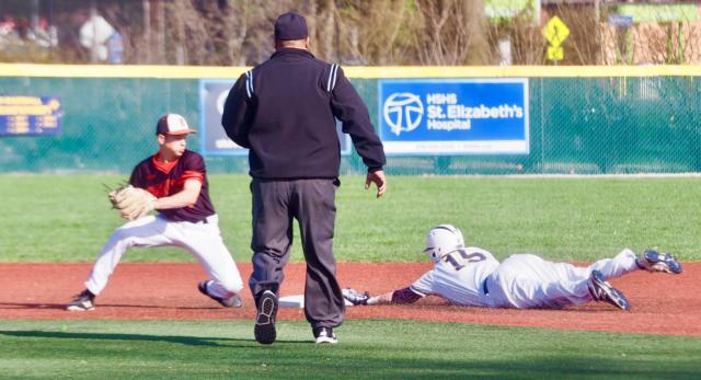 Hayden Juenger (15) slides into second base safely.