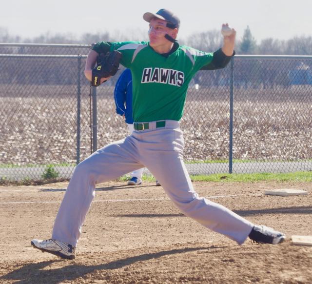 Carrollton's Blake Struble throws a pitch while wearing a protective mask for his injured nose against North Greene on Thursday.