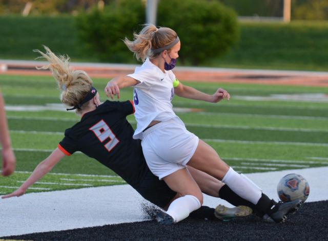 The Edwardsville girls soccer match at home on Tuesday has been cancelled because of the cold weather conditions. EHS junior Payton Federmann shows her constant hustle on the playing field with a valiant attempt at the ball during a recent contest.