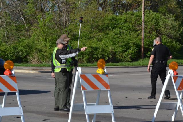 Illinois State Police officers reconstruct the accident scene at 20th and College in Alton on Thursday morning.